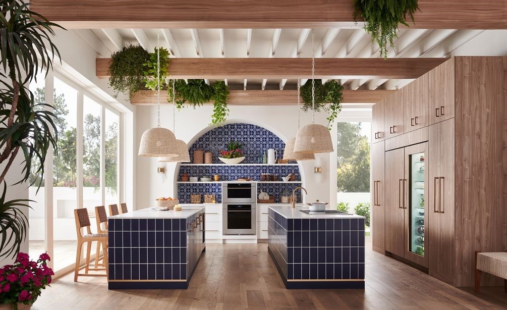 Wolf 30 Inch M Series Transitional Convection Steam Oven displayed in a Mediterranean kitchen design featuring double island, custom blue tile backsplash and exposed wood beam ceiling 